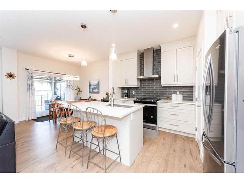124 Emberside Place, Cochrane, AB - Indoor Photo Showing Kitchen With Upgraded Kitchen