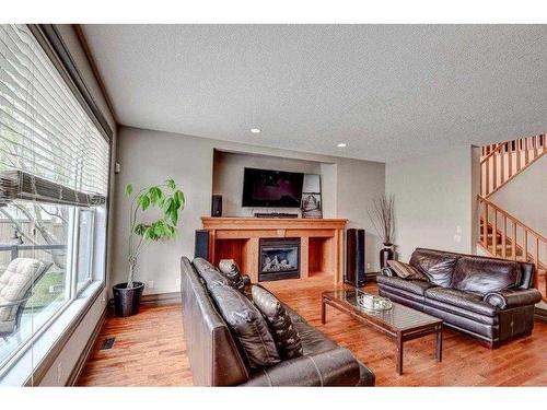 182 Evanspark Circle Nw, Calgary, AB - Indoor Photo Showing Living Room With Fireplace