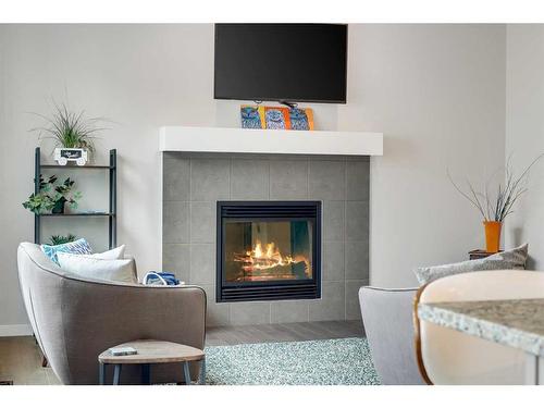 1025 Brightoncrest Common Se, Calgary, AB - Indoor Photo Showing Living Room With Fireplace