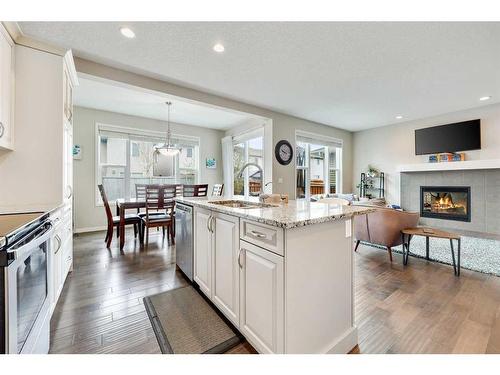 1025 Brightoncrest Common Se, Calgary, AB - Indoor Photo Showing Kitchen With Fireplace With Upgraded Kitchen
