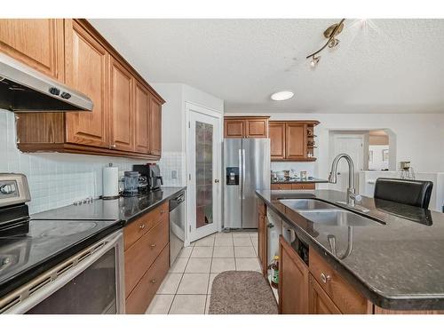 8 Strathlea Close Sw, Calgary, AB - Indoor Photo Showing Kitchen With Double Sink