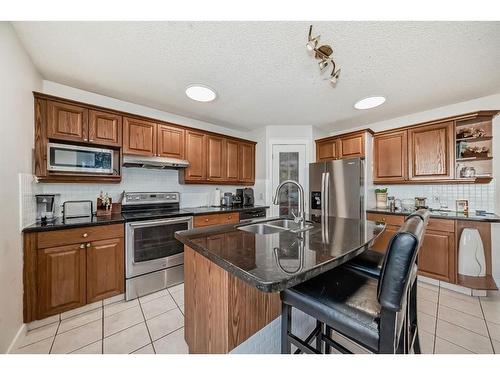 8 Strathlea Close Sw, Calgary, AB - Indoor Photo Showing Kitchen With Double Sink