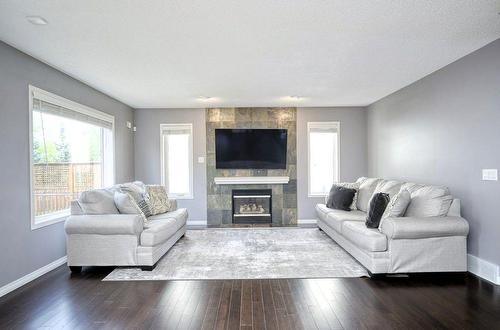 949 Panorama Hills Drive Nw, Calgary, AB - Indoor Photo Showing Living Room With Fireplace