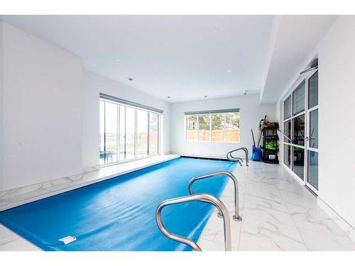 111 Sandpiper Court, Chestermere, AB - Indoor Photo Showing Other Room With In Ground Pool