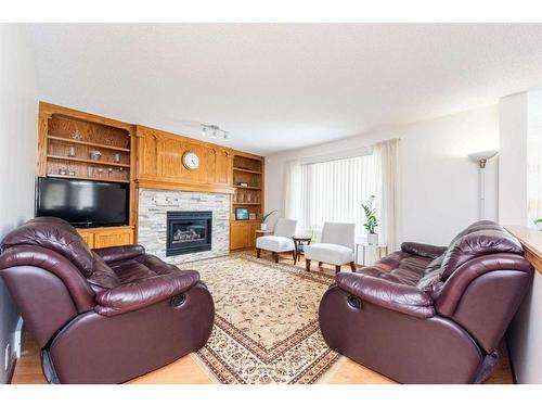9112 Edgebrook Drive Nw, Calgary, AB - Indoor Photo Showing Living Room With Fireplace