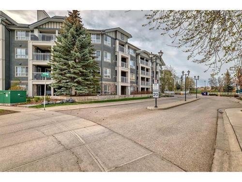 348-35 Richard Court Sw, Calgary, AB - Outdoor With Balcony With Facade