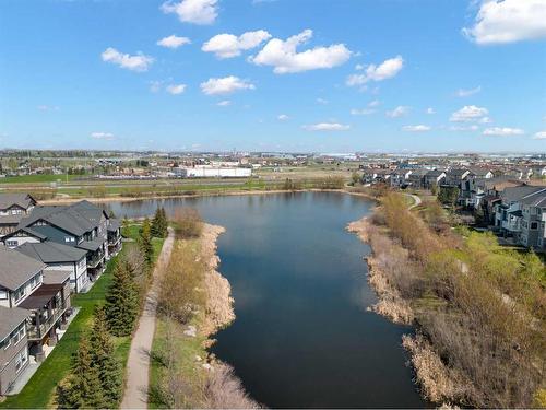 203-110 Coopers Common Sw, Airdrie, AB - Outdoor With Body Of Water With View