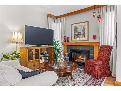 276 Eagle  Terrace Road, Canmore, AB - Indoor Photo Showing Living Room With Fireplace
