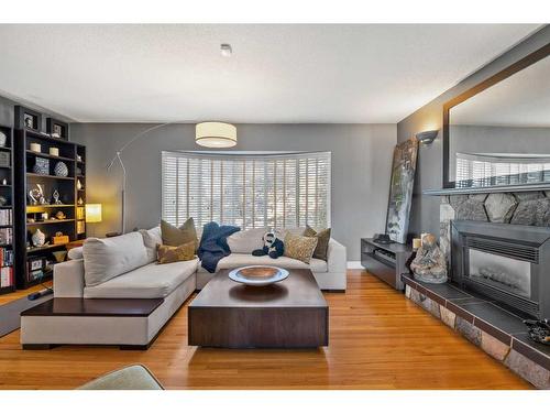 3304 24 Street Nw, Calgary, AB - Indoor Photo Showing Living Room With Fireplace