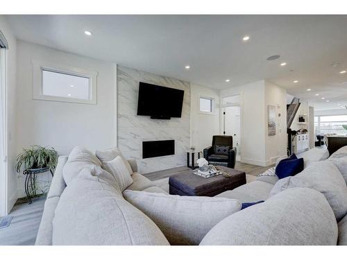 708 13 Street Ne, Calgary, AB - Indoor Photo Showing Living Room With Fireplace
