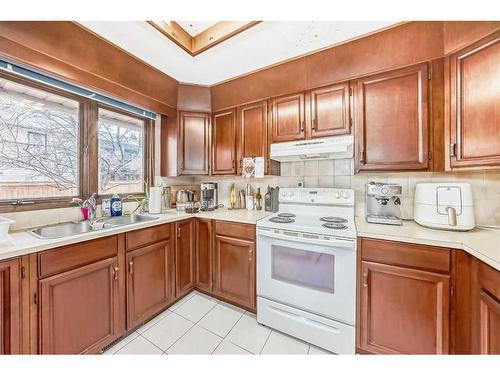 43 Ranchridge Drive Nw, Calgary, AB - Indoor Photo Showing Kitchen With Double Sink