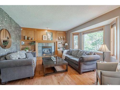 224 Hampshire Court Nw, Calgary, AB - Indoor Photo Showing Living Room With Fireplace