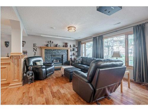 224 Hampshire Court Nw, Calgary, AB - Indoor Photo Showing Living Room With Fireplace