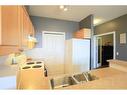 2231-1010 Arbour Lake Road Nw, Calgary, AB  - Indoor Photo Showing Kitchen With Double Sink 