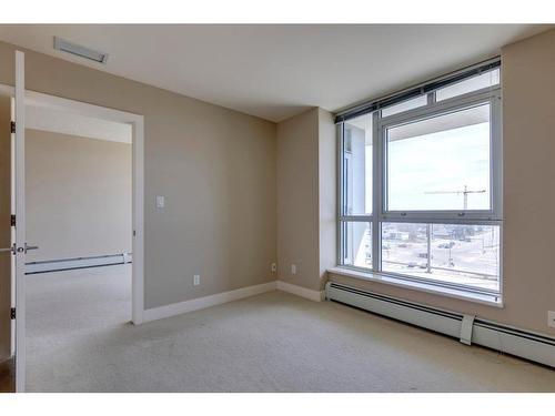 604-99 Spruce Place Sw, Calgary, AB - Indoor Photo Showing Other Room