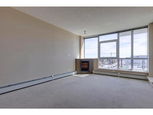 604-99 Spruce Place Sw, Calgary, AB - Indoor With Fireplace