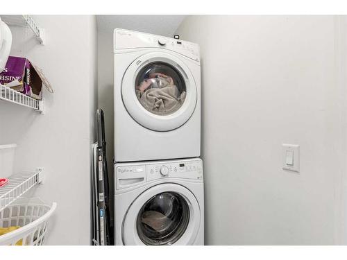 27 Belgian Link, Cochrane, AB - Indoor Photo Showing Laundry Room