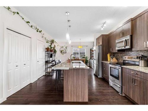 27 Belgian Link, Cochrane, AB - Indoor Photo Showing Kitchen With Upgraded Kitchen