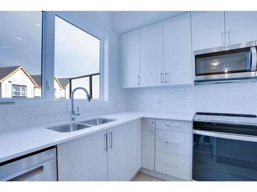 406-75 Evanscrest Common Nw, Calgary, AB - Indoor Photo Showing Kitchen With Double Sink