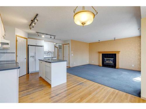 92 Mt Aberdeen Circle Se, Calgary, AB - Indoor Photo Showing Kitchen With Fireplace