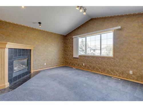 92 Mt Aberdeen Circle Se, Calgary, AB - Indoor Photo Showing Other Room With Fireplace