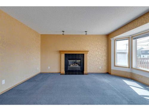 92 Mt Aberdeen Circle Se, Calgary, AB - Indoor Photo Showing Living Room With Fireplace