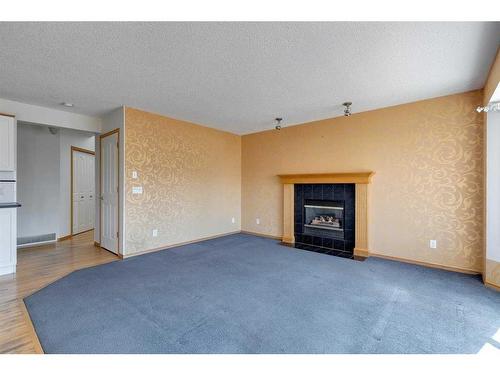 92 Mt Aberdeen Circle Se, Calgary, AB - Indoor Photo Showing Living Room With Fireplace