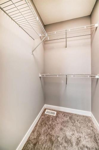253 Midgrove Mews Sw, Airdrie, AB - Indoor With Storage