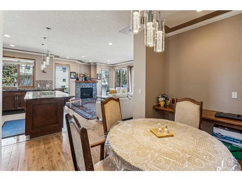 4538 Montgomery Avenue Nw, Calgary, AB - Indoor Photo Showing Dining Room With Fireplace
