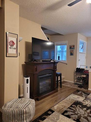 334 Mckenzie Towne Link Se, Calgary, AB - Indoor With Fireplace