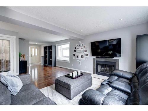 70 Riverwood Crescent Se, Calgary, AB - Indoor Photo Showing Living Room With Fireplace