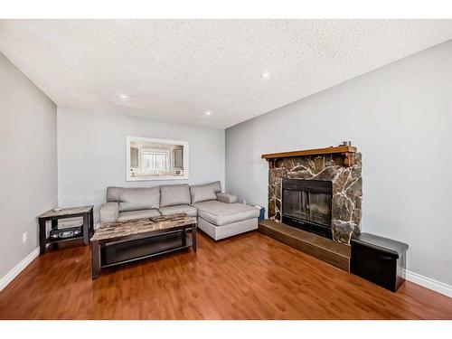 35 Templemont Drive Ne, Calgary, AB - Indoor Photo Showing Living Room With Fireplace