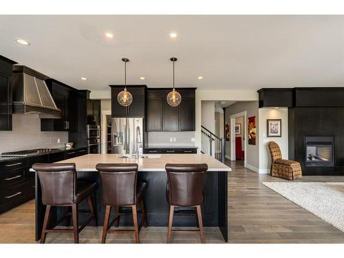 38 Aspen Dale Court Sw, Calgary, AB - Indoor Photo Showing Kitchen With Fireplace With Upgraded Kitchen