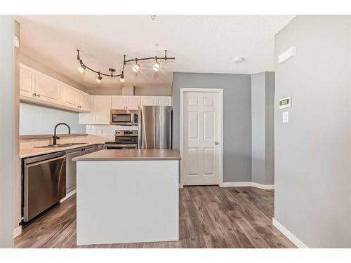 212 Stonemere Place, Chestermere, AB - Indoor Photo Showing Kitchen With Stainless Steel Kitchen