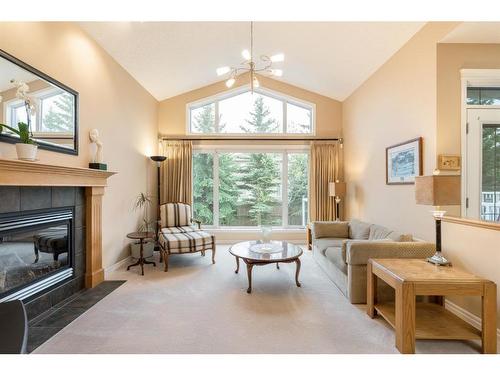 39 West Jensen Place Sw, Calgary, AB - Indoor Photo Showing Living Room With Fireplace