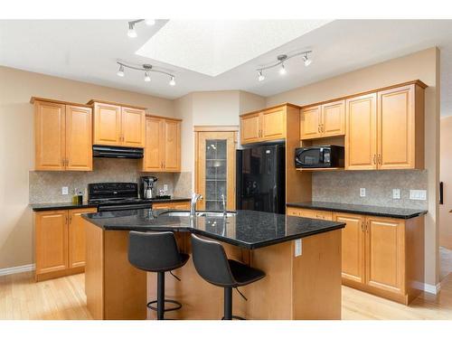 39 West Jensen Place Sw, Calgary, AB - Indoor Photo Showing Kitchen With Double Sink
