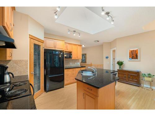 39 West Jensen Place Sw, Calgary, AB - Indoor Photo Showing Kitchen With Double Sink