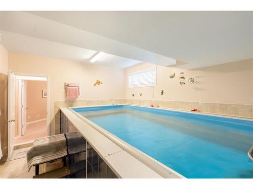 39 West Jensen Place Sw, Calgary, AB - Indoor Photo Showing Other Room With In Ground Pool