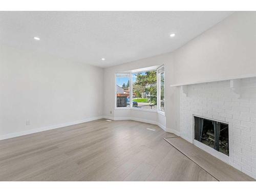 4220 58 Street Ne, Calgary, AB - Indoor Photo Showing Living Room With Fireplace