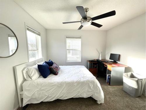 601 Prairie Sound Circle Nw, High River, AB - Indoor Photo Showing Bedroom