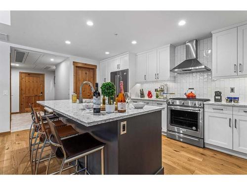 103-1105 Spring Creek Drive, Canmore, AB - Indoor Photo Showing Kitchen With Stainless Steel Kitchen With Upgraded Kitchen