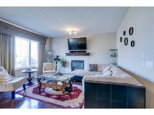 405 Taralake Landing Ne, Calgary, AB - Indoor Photo Showing Living Room With Fireplace