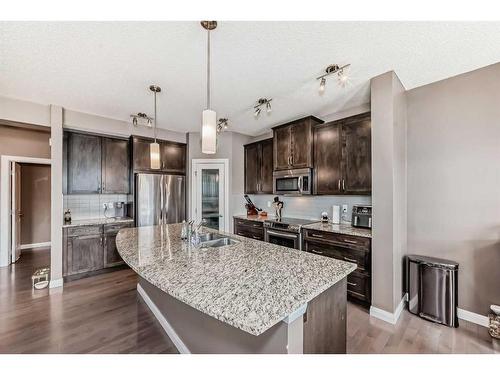 136 Ravenskirk Close Se, Airdrie, AB - Indoor Photo Showing Kitchen With Double Sink With Upgraded Kitchen