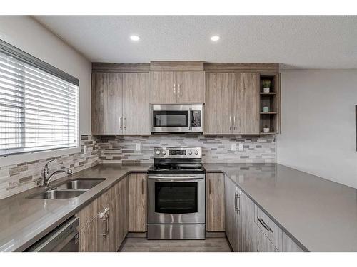 318 Legacy Village Way Se, Calgary, AB - Indoor Photo Showing Kitchen With Stainless Steel Kitchen With Double Sink