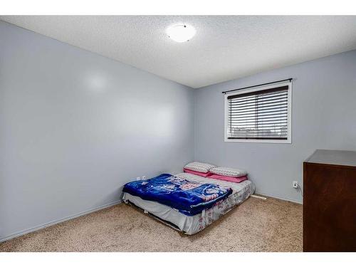 19 Saddlemont Way Ne, Calgary, AB - Indoor Photo Showing Bedroom