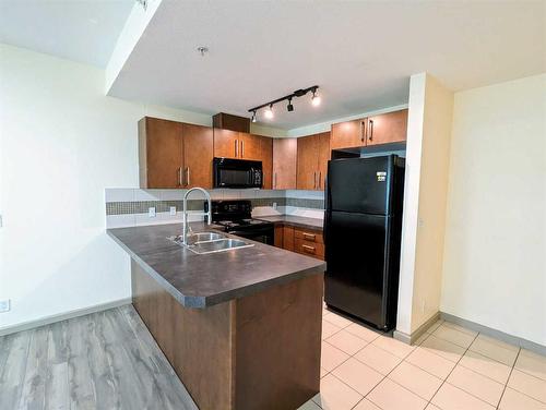 1303-210 15 Avenue Se, Calgary, AB - Indoor Photo Showing Kitchen With Double Sink