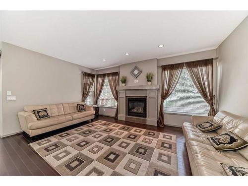 151 Everbrook Drive Sw, Calgary, AB - Indoor Photo Showing Living Room With Fireplace