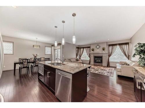 151 Everbrook Drive Sw, Calgary, AB - Indoor Photo Showing Kitchen With Fireplace