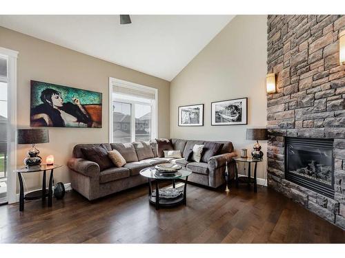 628 Windridge Road Sw, Airdrie, AB - Indoor Photo Showing Living Room With Fireplace