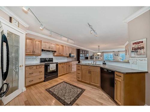 335-8535 Bonaventure Drive Se, Calgary, AB - Indoor Photo Showing Kitchen With Double Sink